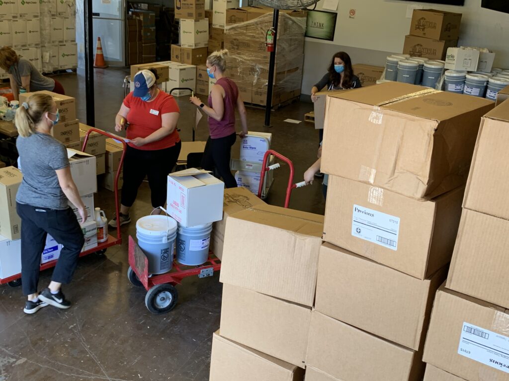 Staff moving supplies