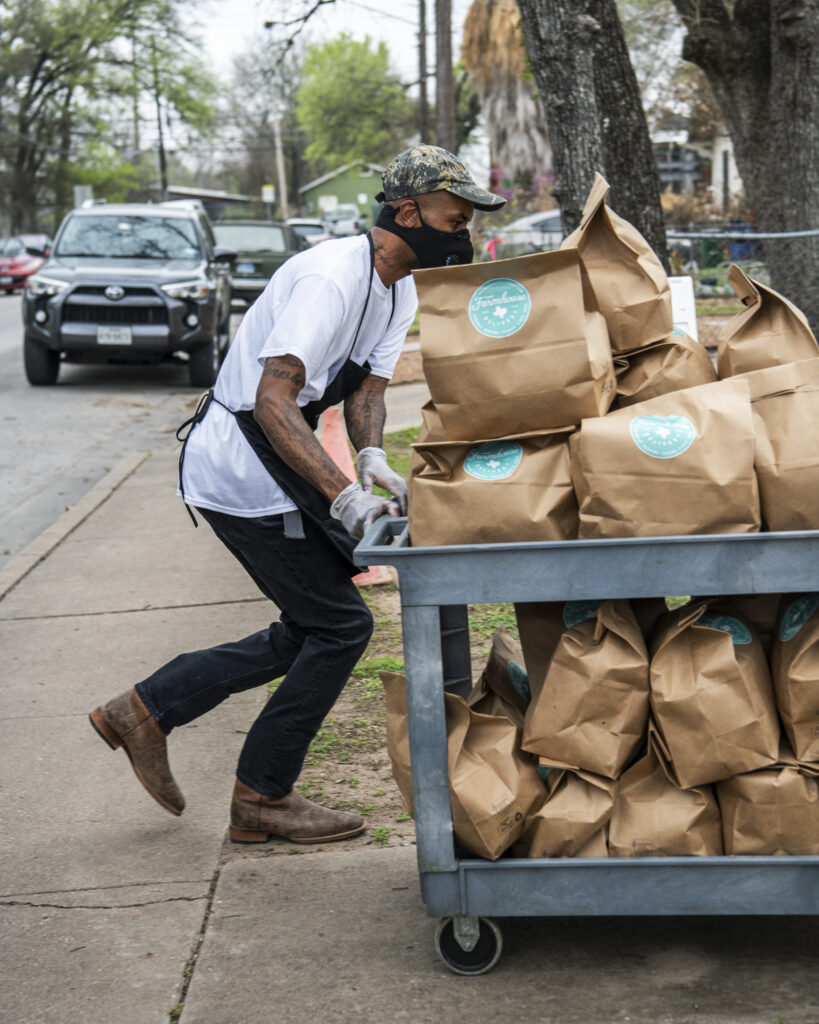 Man pushing cart with meal kits