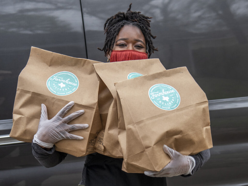 Woman holding meal kits