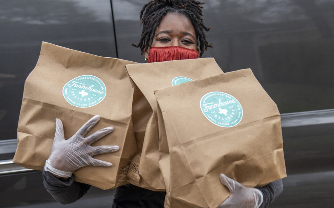 Woman holding meal kits