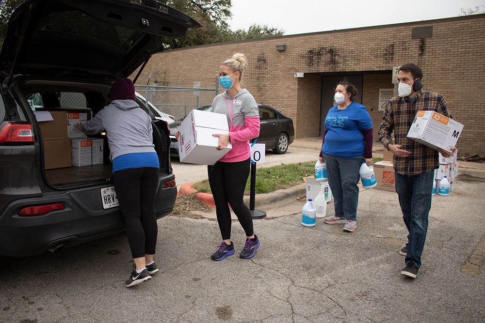 WFS staff load supplies into a provider's vehicle.
